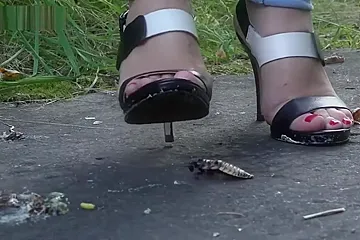 Outside roach crushing in high heels. - porn video
