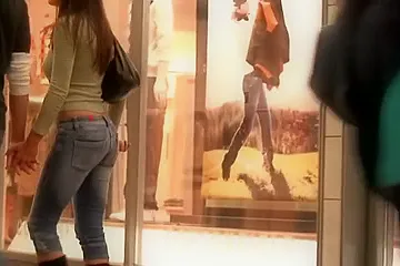 Hot chick wiggles her ass in tight jeans for the spy cam (fake) - porn video