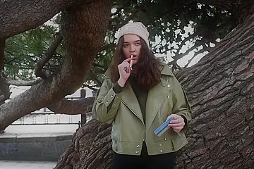 Young Brunette Is Taking An Unhurried Stroll With Allwhite 120mm Cigarette (18+) - porn video