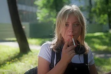 Sweet Polina Is Smoking 120mm Cork Cigarettes In The Park - porn video